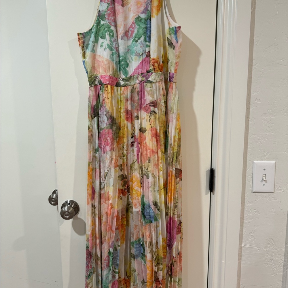 Beautiful floral gown. Worn one time for a wedding